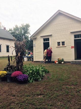 Holmes Schoolhouse with Plants in Front of It