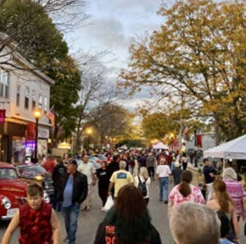 a bunch of people in the street downtown 