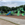 a large green playground with blue slides